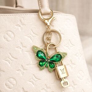 Authentic Louis Vuitton Gold Lock & Key with unbranded Green Butterly Bagcharm